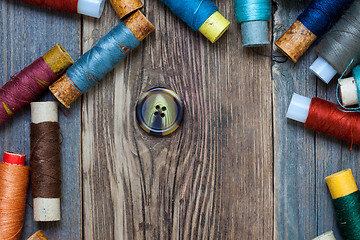 Image showing vintage button and spools of thread