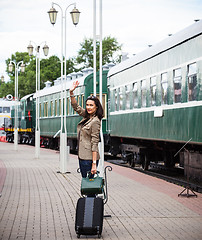 Image showing Woman traveler with luggage