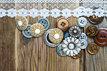 Image showing vintage buttons and lace tape