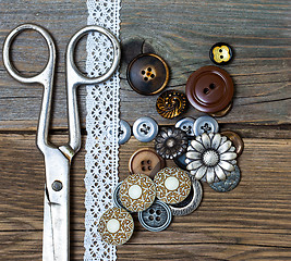 Image showing vintage buttons, tape lace and a tailor scissors 