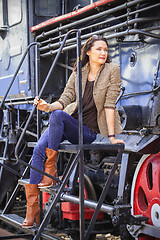 Image showing retro travel fashion portrait of a beautiful adult woman