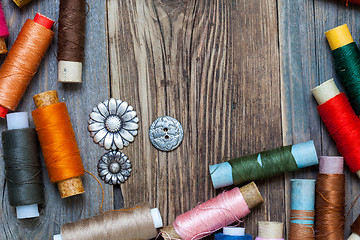 Image showing vintage tools of thread and old buttons