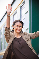 Image showing woman waving hand from the passenger wagon