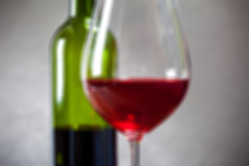 Image showing red wine in goblets and green bottle