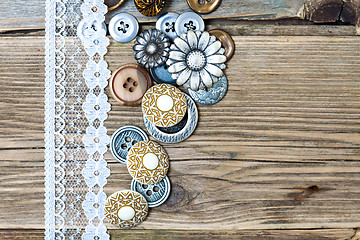 Image showing vintage buttons and lace tape