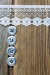 Image showing vintage button and lace tape