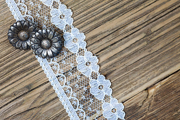 Image showing vintage button and lace tape