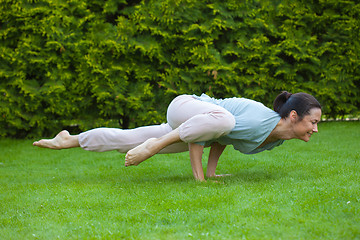 Image showing pretty adult woman doing yoga