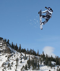 Image showing Snowboarder jumping