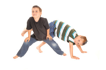 Image showing Two little boy\'s dancing on the floor.