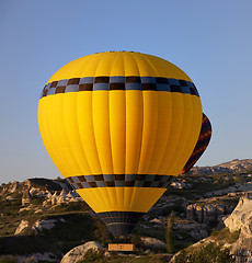 Image showing Hot air balloons in mountains at early morning