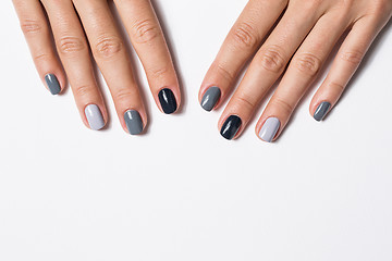 Image showing Hand with a stylish gray manicure isolated on white background