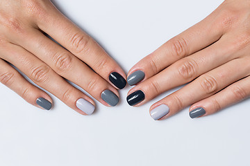 Image showing Hand with a stylish gray manicure isolated on white background