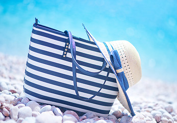 Image showing bag and hat on the beach