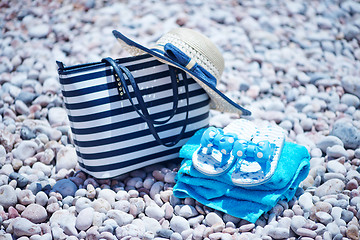 Image showing bag and hat on the beach