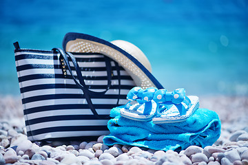 Image showing bag and hat on the beach