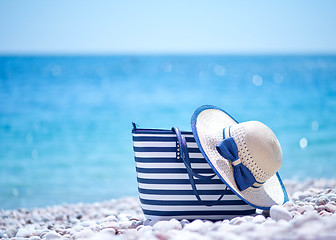 Image showing bag and hat on the beach