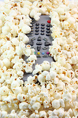 Image showing remote control under popcorn