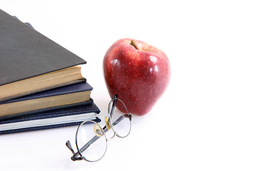 Image showing red apple and books