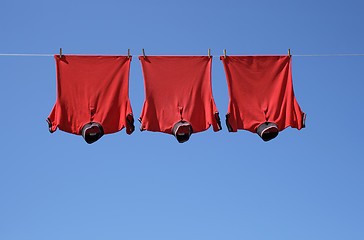 Image showing Laundry, three red t-shirts