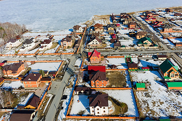 Image showing Aerial view on suburban street near lake at spring