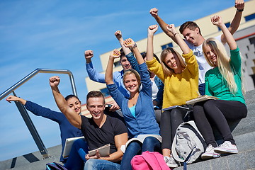 Image showing students outside sitting on steps