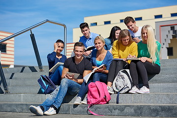 Image showing students outside sitting on steps