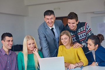 Image showing group of students getting suppport from teacher