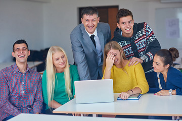 Image showing group of students getting suppport from teacher