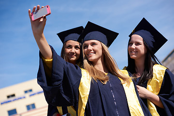 Image showing students group in graduates making selfie