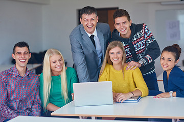 Image showing group of students getting suppport from teacher