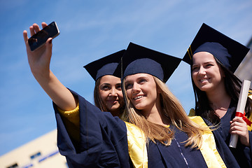 Image showing students group in graduates making selfie