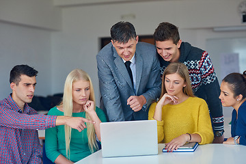 Image showing group of students getting suppport from teacher