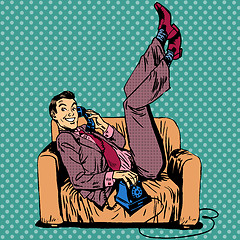 Image showing Lazy man sofa talking phone