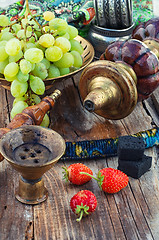 Image showing Hookah on  wooden table