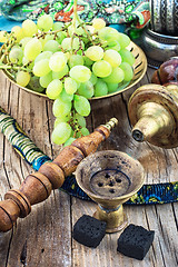 Image showing Hookah on  wooden table