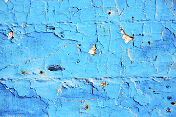 Image showing dirty  paint in  blue   door  rusty nail