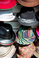 Image showing in london old red hat and black  the  fashion shop