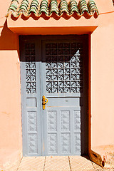 Image showing old door in ornate brown