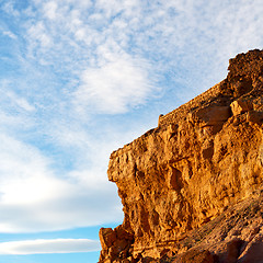 Image showing sunset in africa old construction near       the river blue