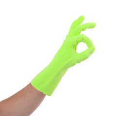 Image showing Hand gesturing with green cleaning product glove