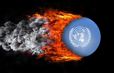 Image showing Flag with a trail of fire and smoke - United Nations