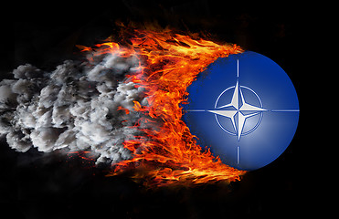 Image showing Flag with a trail of fire and smoke - NATO