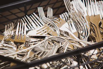 Image showing Closeup of shiny spoon, knife, fork