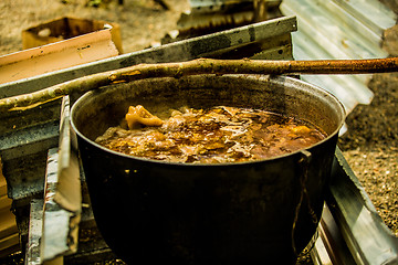 Image showing Cooking goulash outdoors