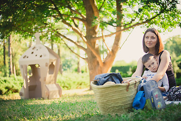 Image showing Mother and son in the park summer day.