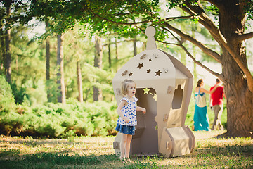 Image showing girl playing in cardboard spaceship 