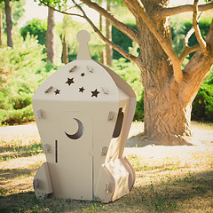 Image showing Cardboard toy spaceship in the park
