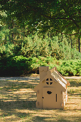 Image showing Toy house made of corrugated cardboard in the city park 