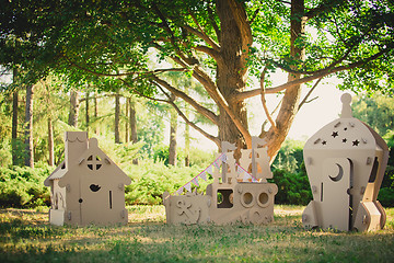 Image showing Eco-friendly toys made of cardboard ship, house and  spaceship.